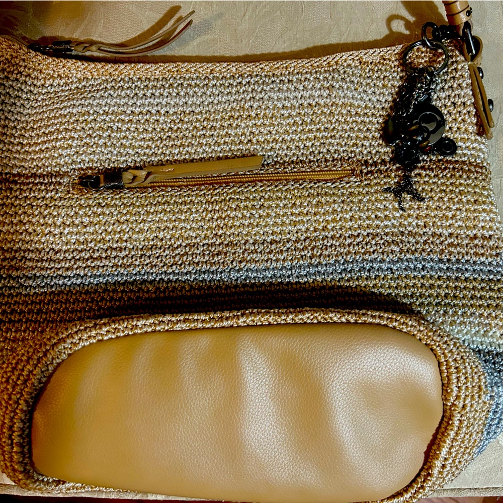 New without tags woven Sak Indio bag with leather strap.